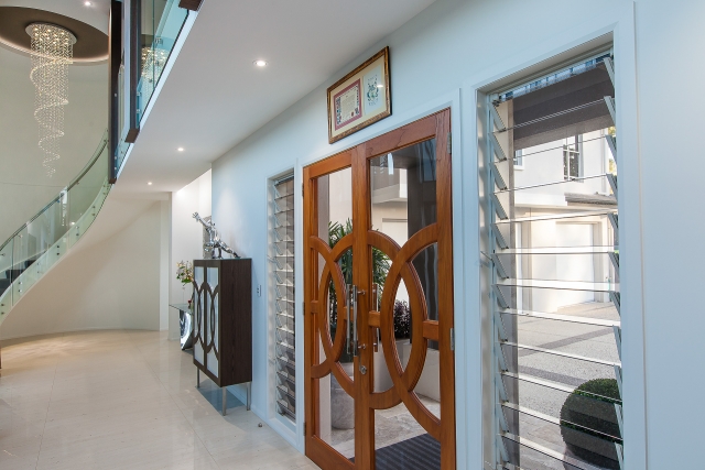 Luxury home, entry, spiral staircase, chic, classy, marble tiles, custom furniture, cinema doors, minka joinery