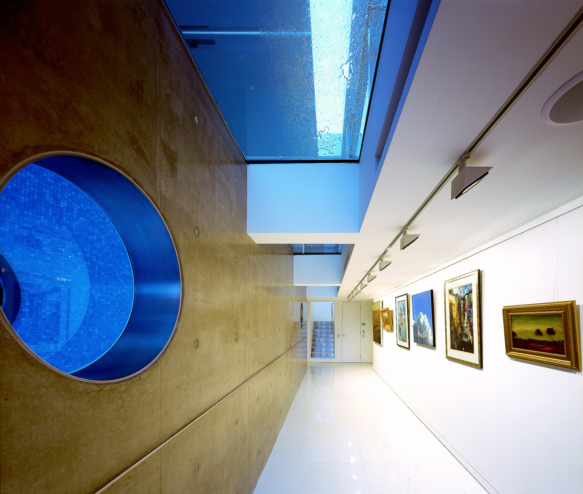 art room, art show, minimal, polished concrete walls, port hole, futuristic, minka joinery